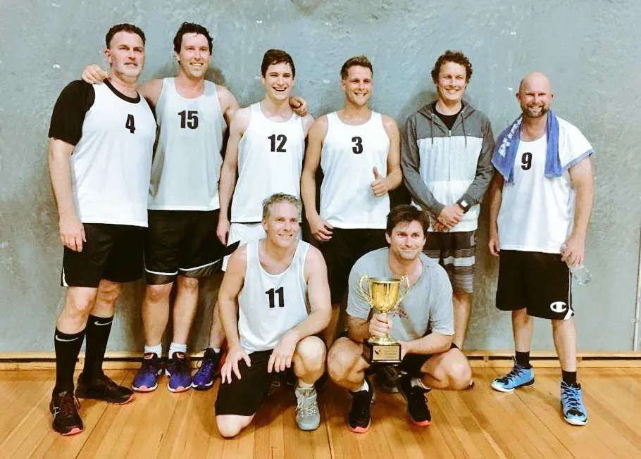 Basketball rec league champions team photo with the cup